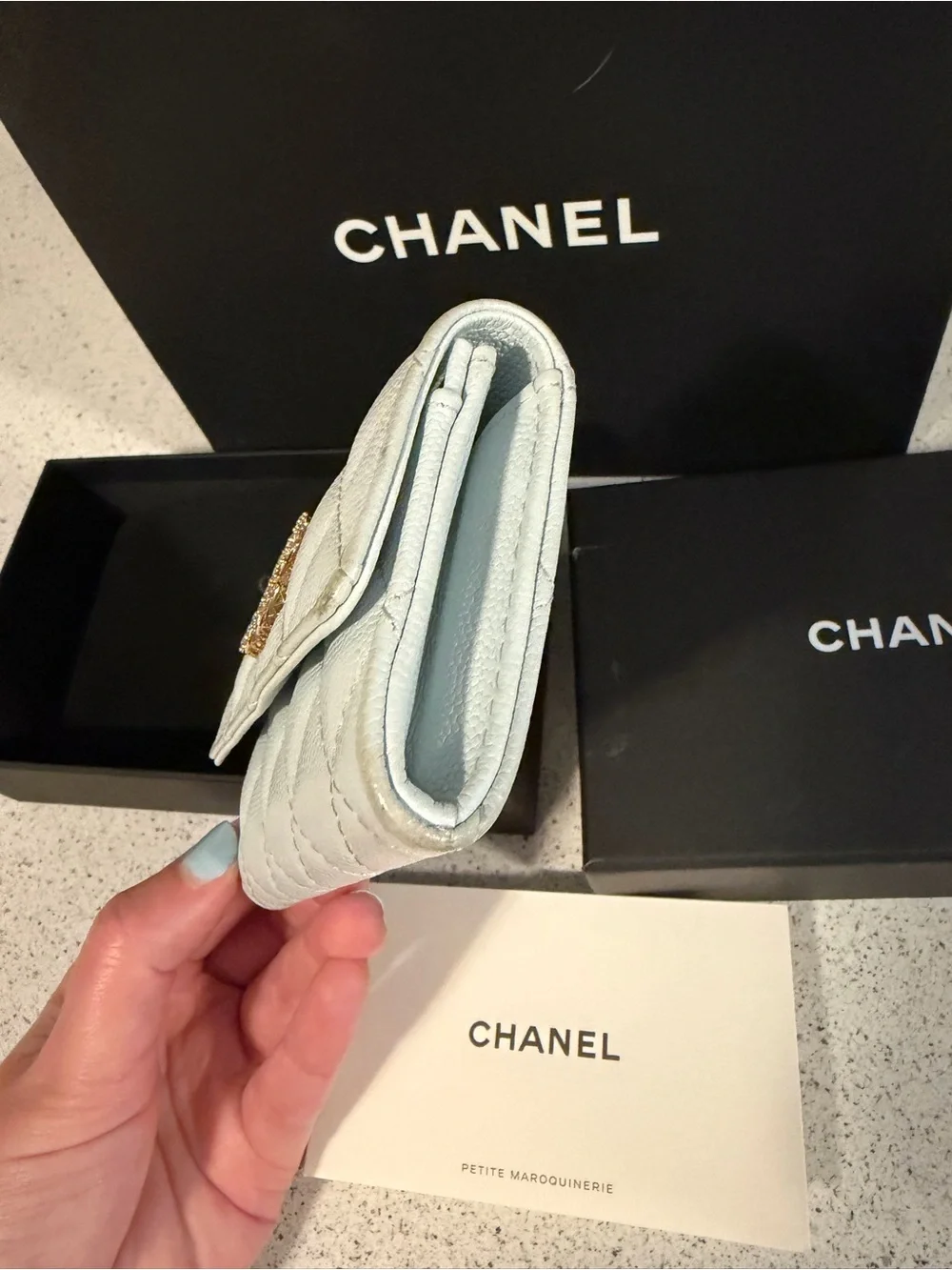 Chanel shiny caviar quilted crystal CC flap card holder light blue